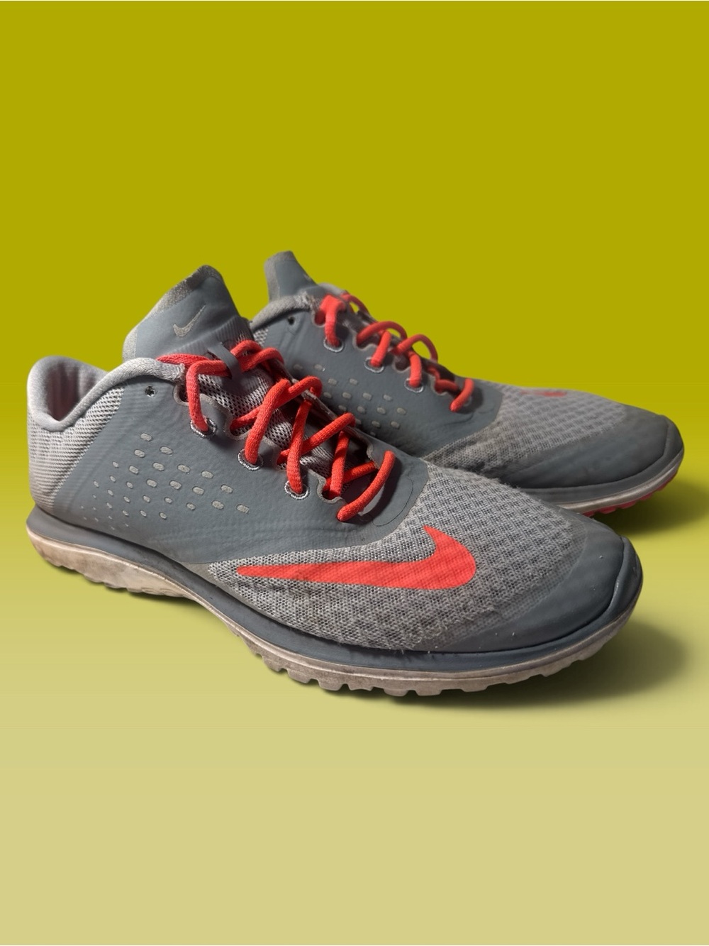 Nike Men's Grey Athletic Shoes with Red Accents